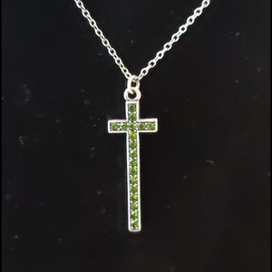 Dark metal with green stone cross